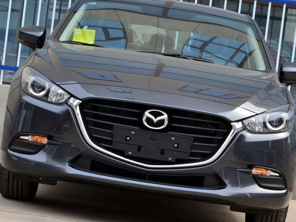 Mazda 3 Exela replacement headlamp cover with snake glue adhesive tube.