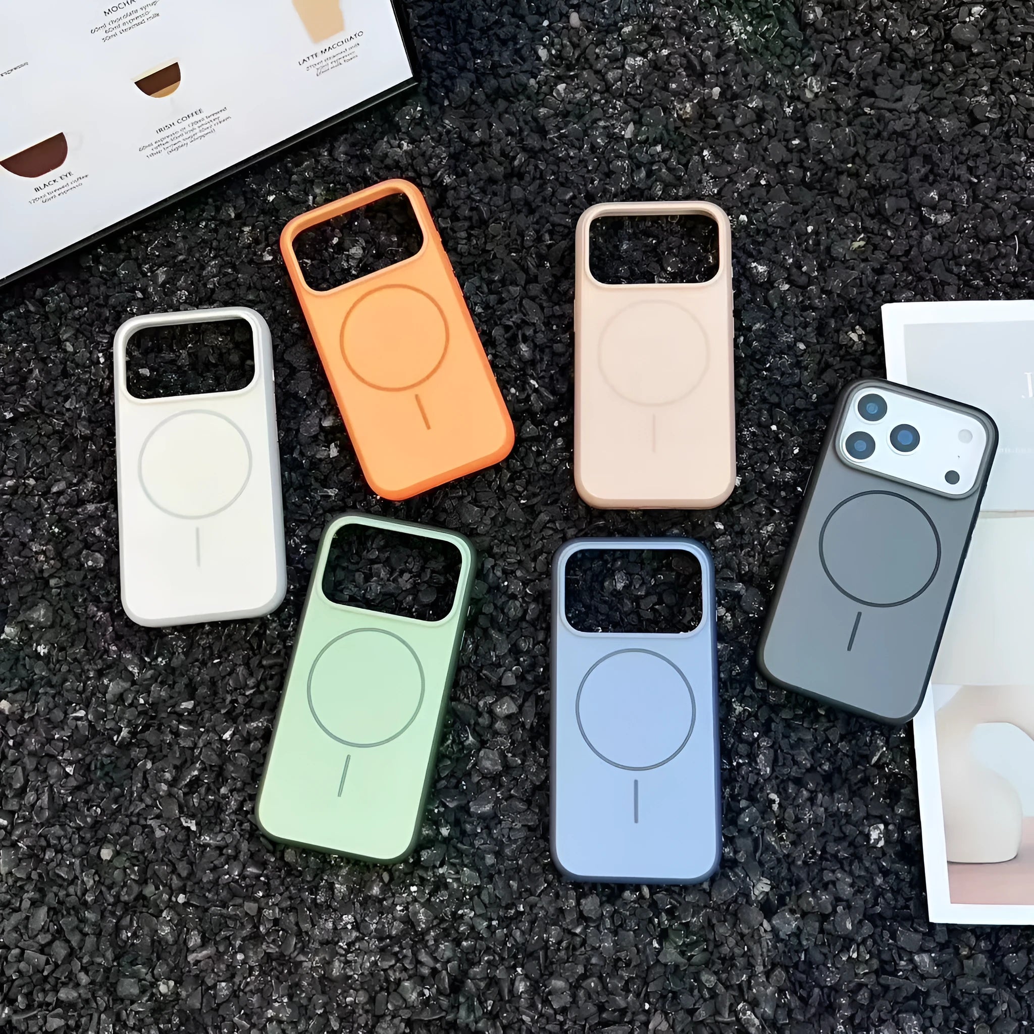 Blue frosted magnetic iPhone case showing a side button labelled 'AI' for camera controls.