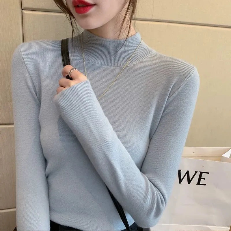Slim fit knitted viscose shirt in a neutral colour showing long sleeves and pullover design.