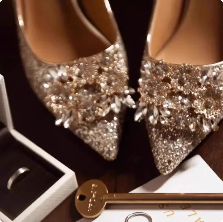 Champagne coloured pointed toe bridal shoes with rhinestone flower pattern and fine heel.