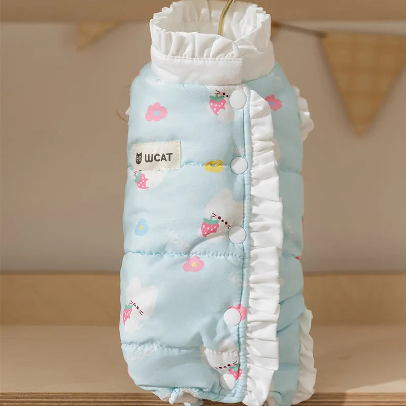 Cream fleece pet jumpsuit with bear print and white ruffles, four-legged design on small dog