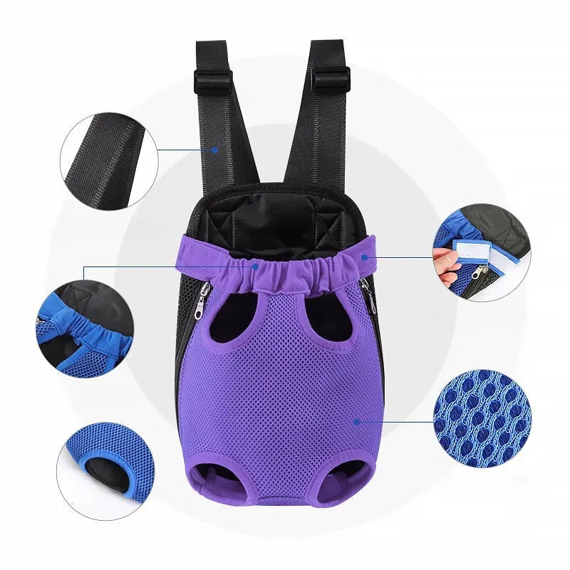 A person wearing an adjustable black nylon dog carrier backpack on their front, containing a small dog looking out.