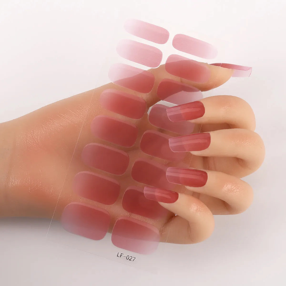 16 solid colour full nail art stickers with 22 patterns including cross, rose, butterfly designs in 12x6mm oval size