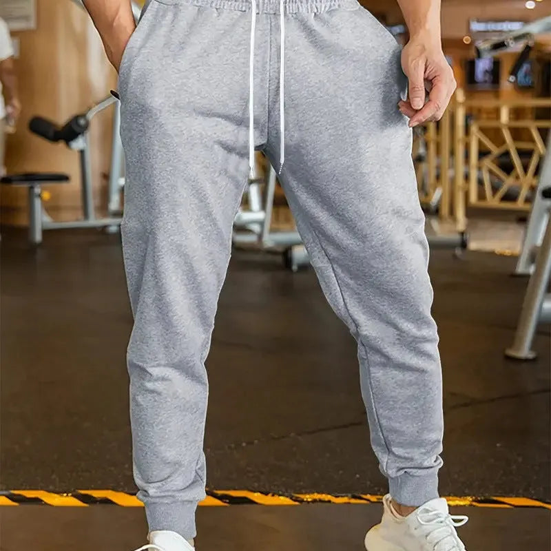Men's linen-style trousers with elastic drawstring waist in loose fit design