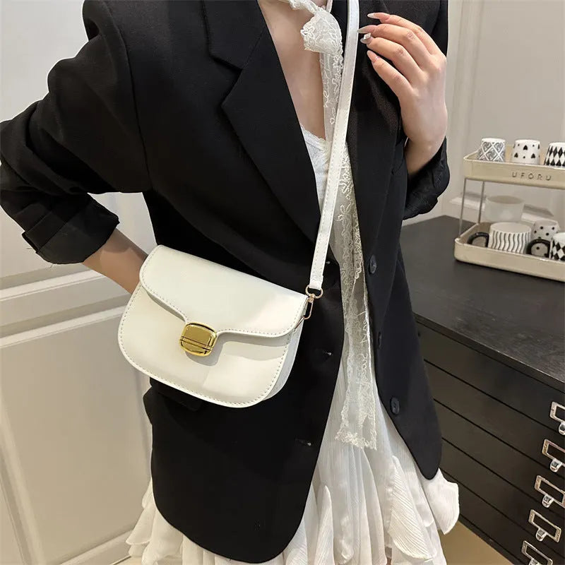 Simple PU leather women's handbag showing internal zipper pocket and phone compartment