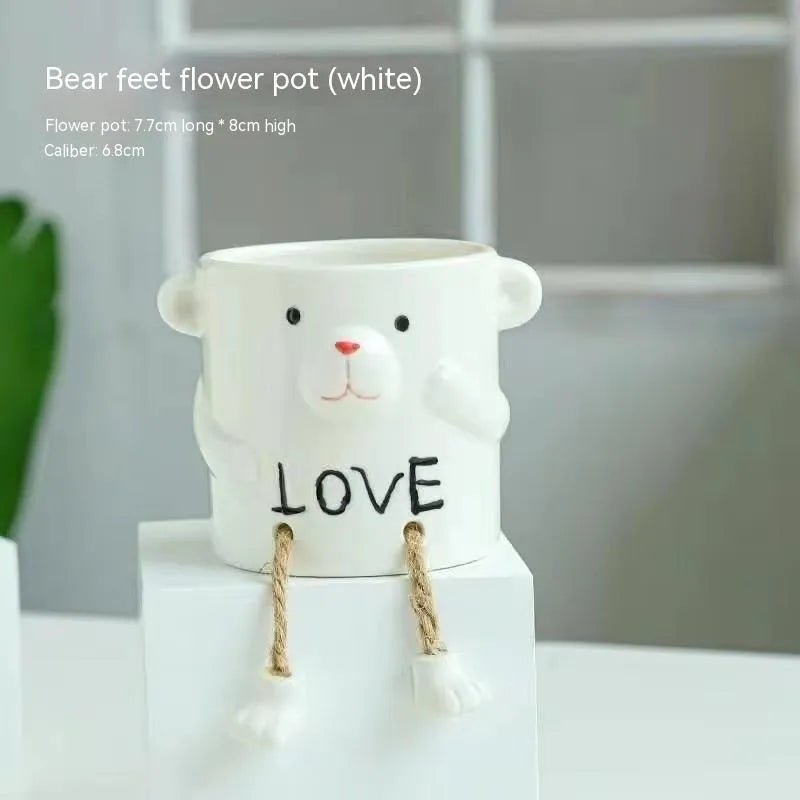 Ceramic hanging foot flowerpot in a cartoon style, shown as a desktop planter for succulent plants.