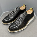 Men's low-top handmade shoes with embossed pattern on upper, shown in black with front tie laces.