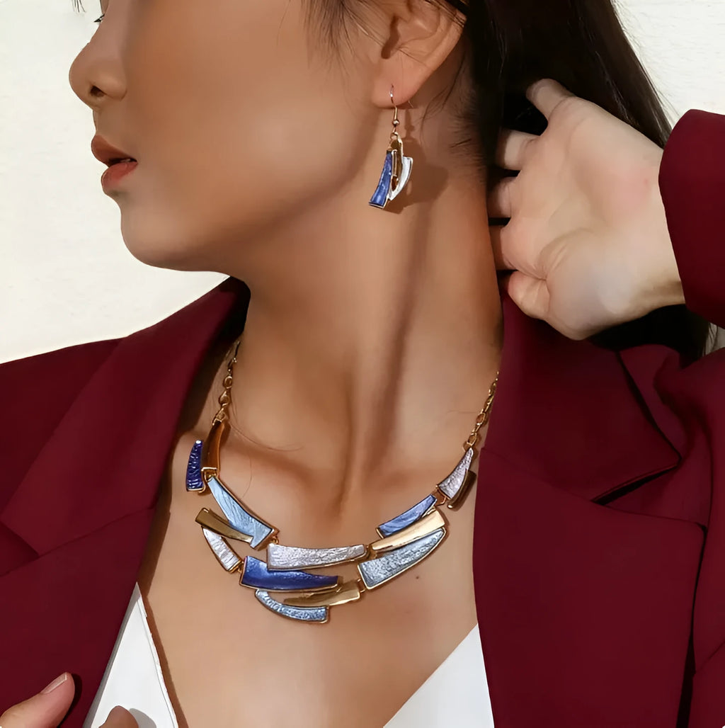 Blue zinc alloy bohemian necklace and earring set with irregular quadrilateral pendants on a light surface