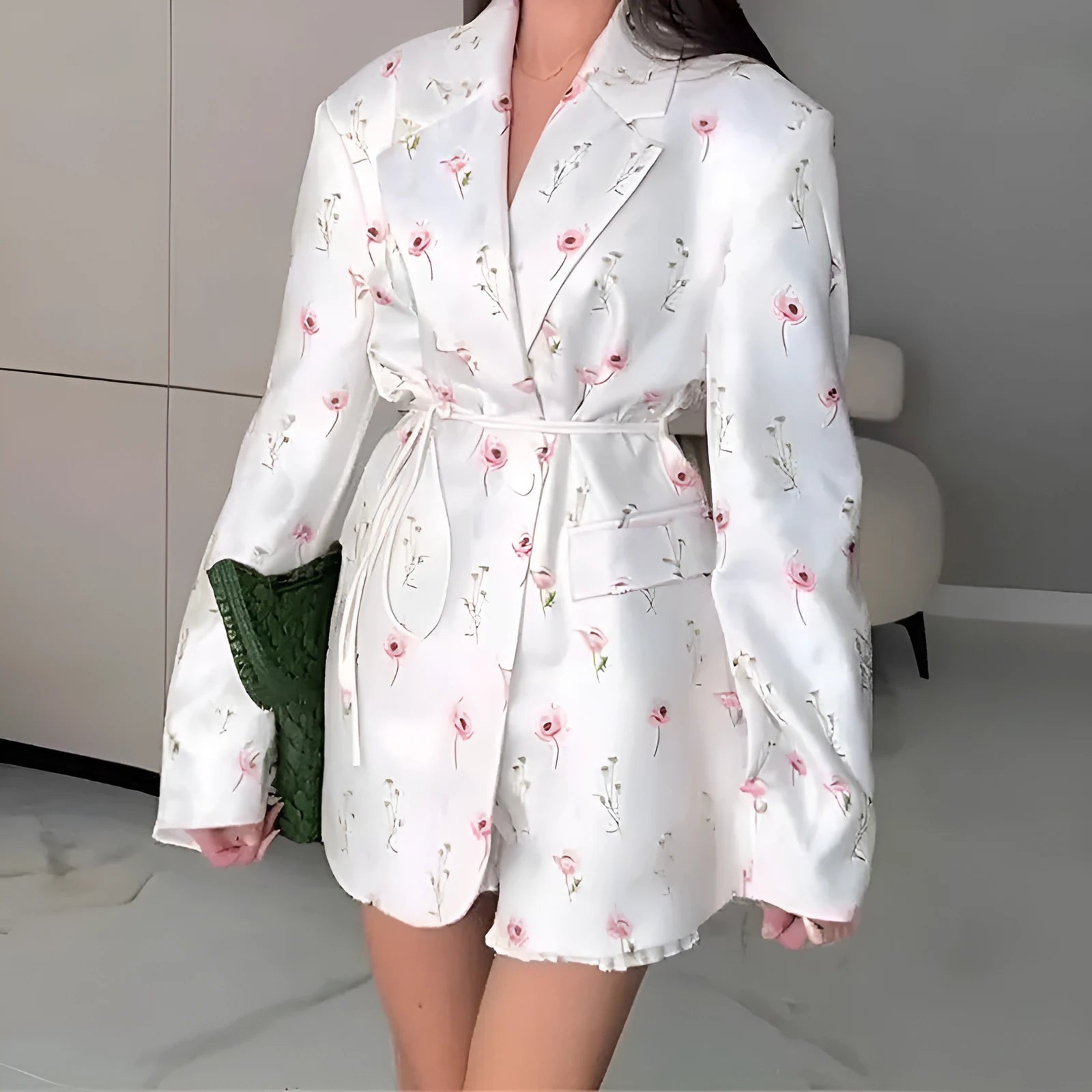 Women's white suit jacket with a lace-up detail on the collar and an adjustable waist tie, shown in a regular fit with long sleeves.
