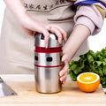 Manual stainless steel citrus juicer with 304 filter and press handle on a kitchen counter