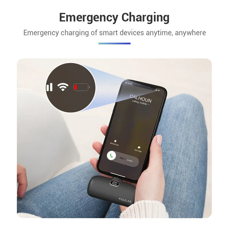 Compact cylindrical alloy power bank with built-in Lightning charging cable showing LCD display.