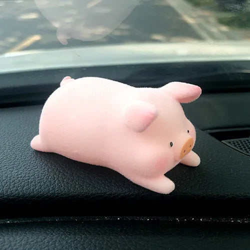 Cartoon pig character resin ornament for car dashboard decoration.