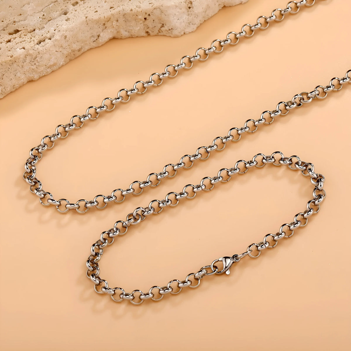 Silver stainless steel men's punk ring buckle necklace with O-ring chain and copper zircon pendant on dark background