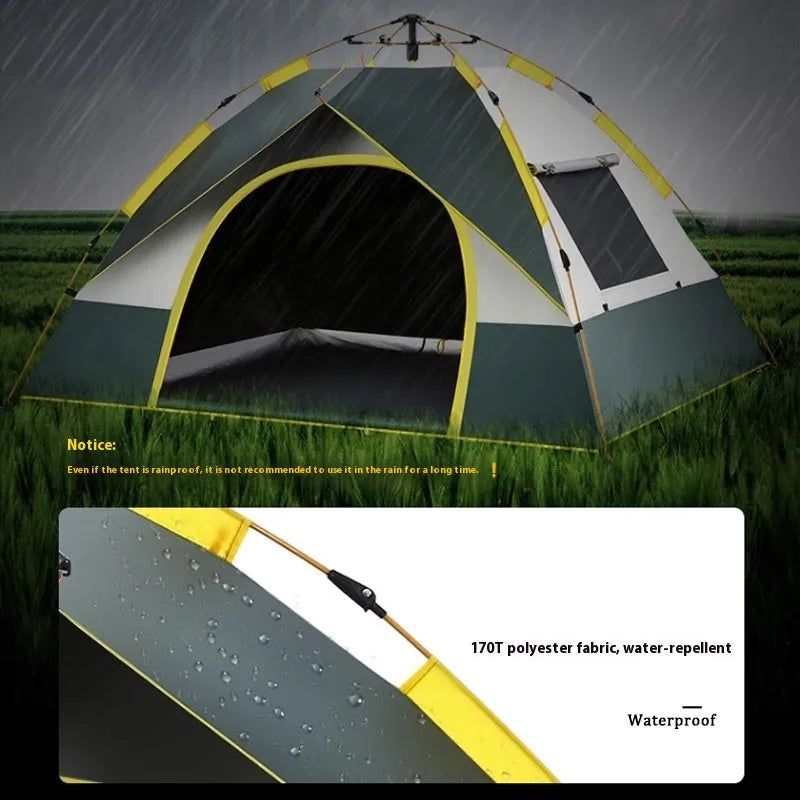 Dark green and silver automatic pop-up camping tent pitched in a field.