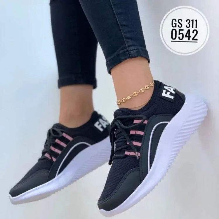 Women's lace up mesh sneakers in pink with cross strap design, round toe, rubber sole, medium heel