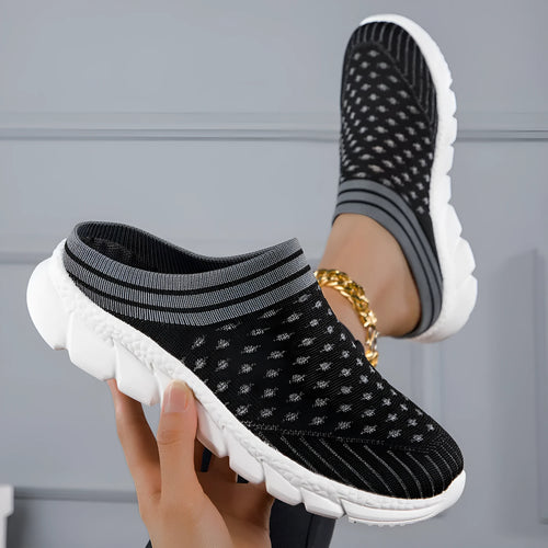Black women's Flyknit sports slipper with hollowed-out pattern and striped design on a light background.