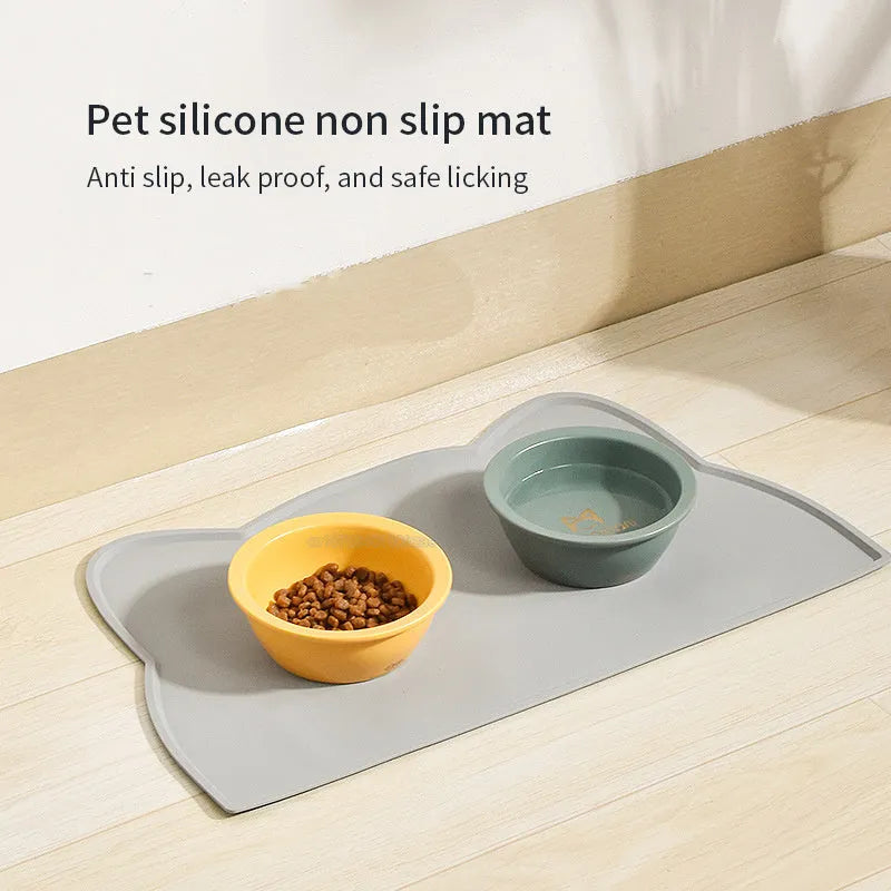 Cat head shaped silicone pet feeding mat in solid colour measuring 44cm by 24cm