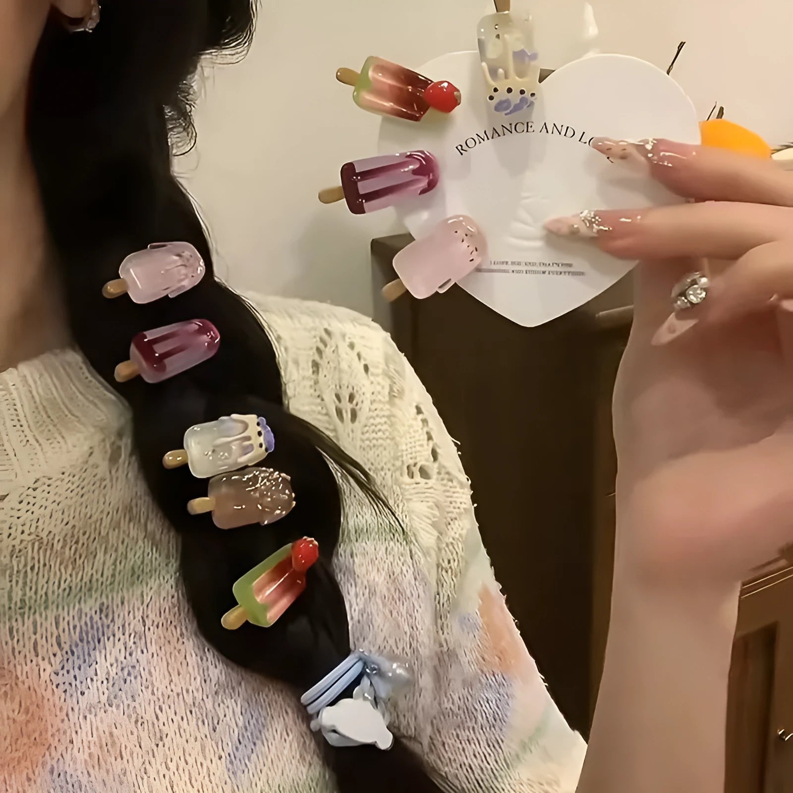 Cartoon ice cream design resin hair barrette clip in side view showing colour options.