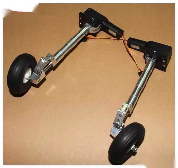 Alloy retractable shock-absorbing landing gear for RC toy aircraft with choice of wheels.