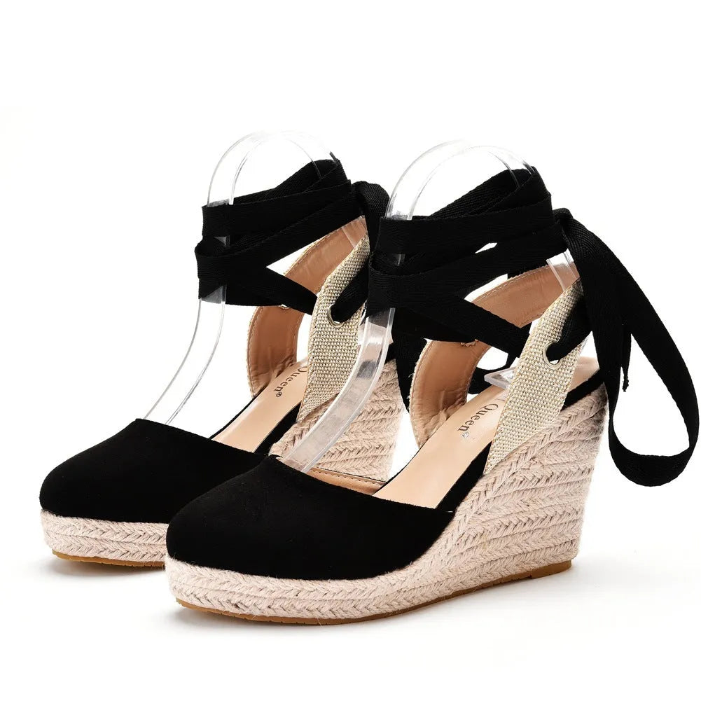 Women's red bohemian wedge sandals with beads, a buckle, and a fish mouth toe.