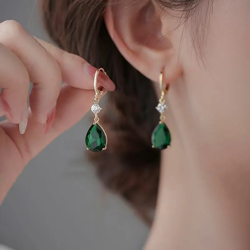 Green geometric teardrop alloy earrings with contemporary shape and lightweight construction