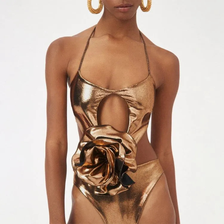 Gold halter one-piece swimsuit with hollow out design on mannequin