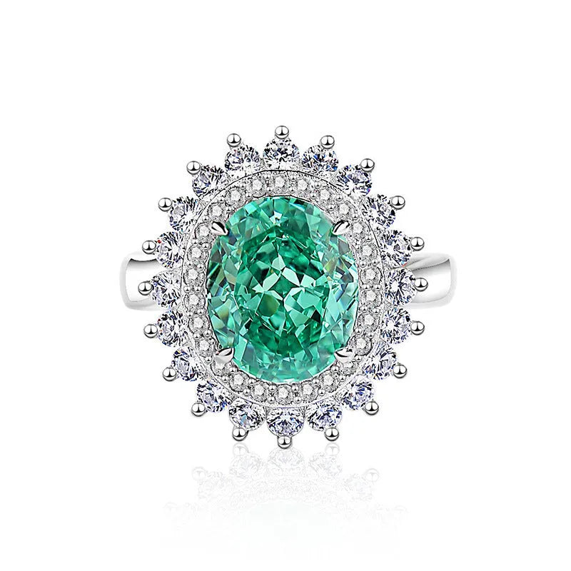 S925 sterling silver women's ring with ellipse emerald and inlaid high carbon diamond in geometric setting.
