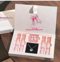 Butterfly Box makeup set showing four matte lip mud tubes and blush compact with chain necklace