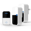 White plastic self-generating wireless doorbell kit with separate button and receiver units.