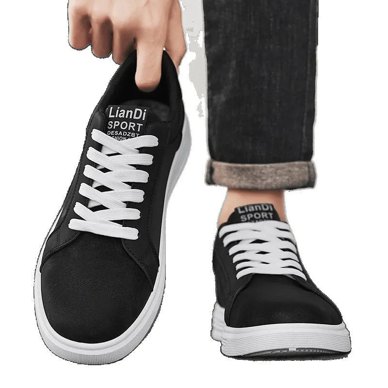 Men's black snake pattern PU leather casual sneakers with round toe and flat rubber sole on a white background