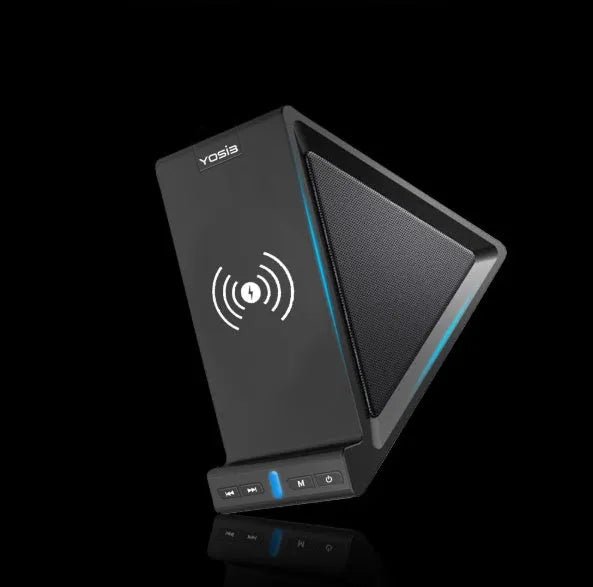 Black multifunctional Bluetooth speaker with integrated phone stand and wireless charging pad, showing size scale.