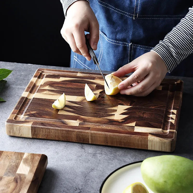 Brown parquet-pattern solid wood chopping board with 3cm thickness on a kitchen counter.
