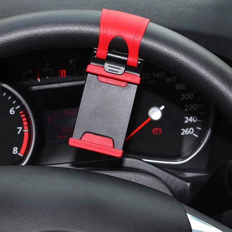 Black universal car steering wheel clip mount holder showing a mobile phone securely attached.