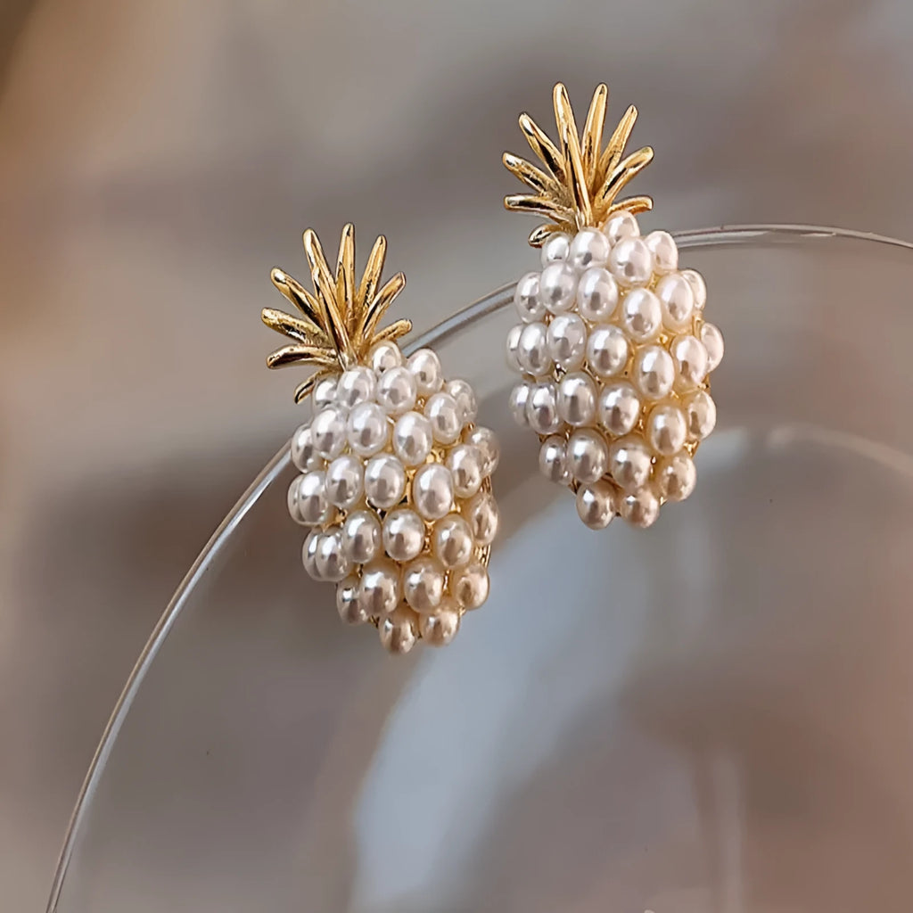 Women's gold Korean style alloy earrings with pineapple and starfish charms inlaid with artificial gems.