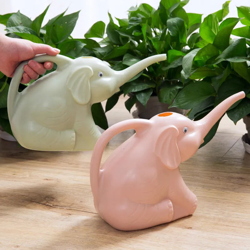 Pink elephant-shaped children's watering can with a long nozzle for gardening.