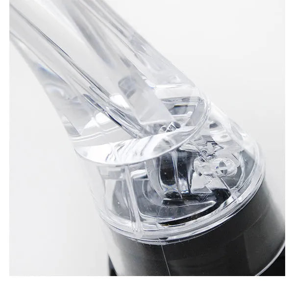 Compact clear acrylic wine aerator with a stainless steel filter, measuring 16cm long.