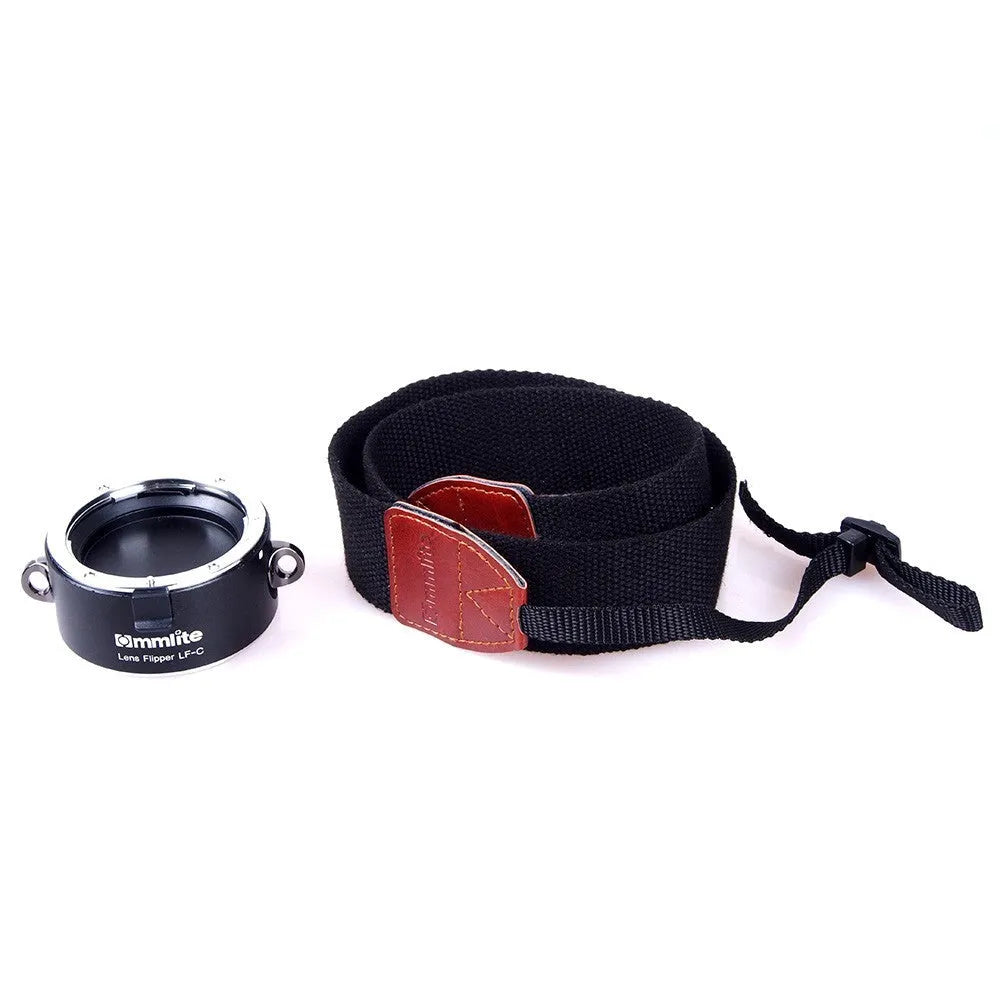 Aluminum alloy dual camera lens flipper holder with cotton strap for Canon, Nikon, and Sony cameras.