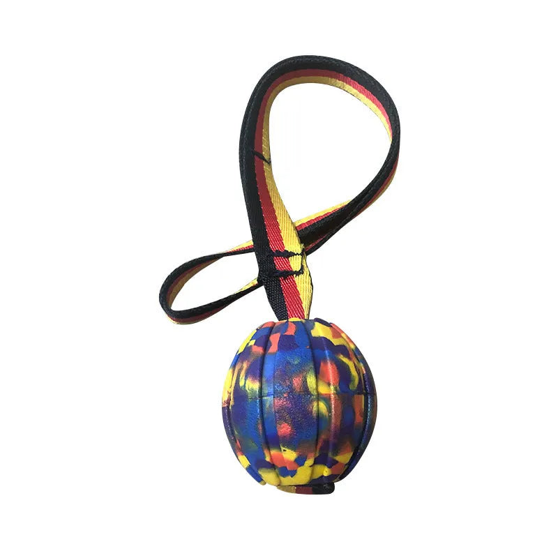 Floating EVA pet training ball in camouflage or yellow colours with attached string, shown in 6.5cm, 7cm, and 9cm diameter sizes