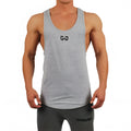 Men bodybuilding tank top in black, muscle fit sleeveless gym vest on model