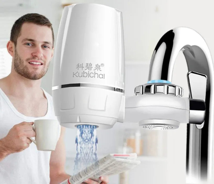 White plastic faucet water filter with ceramic cartridge and universal tap adapter kit.