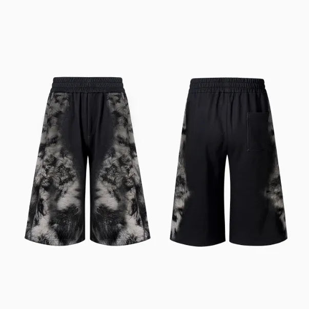 Women's grey loose-fit co-ord set with collage-stitch hoodie, matching trousers, and seven-inch shorts on a hanger.