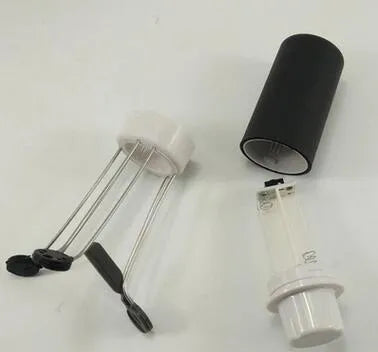White and black wireless automatic blender with stainless steel stirring arms on kitchen counter
