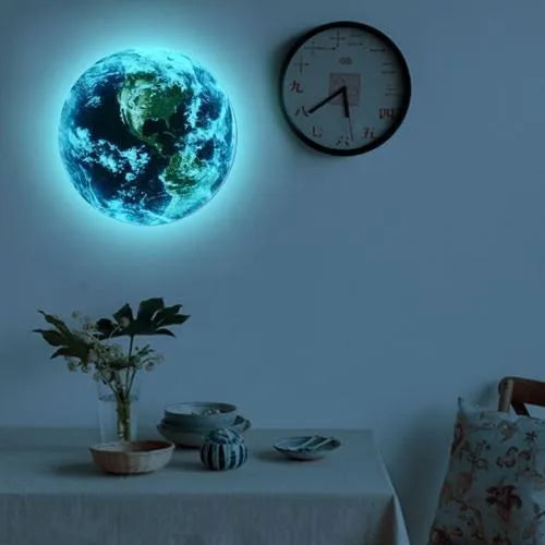 Glow in the dark 3D Earth planet wall sticker in three size options on a dark blue background.