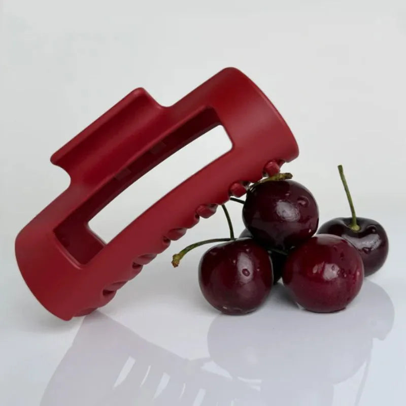 Extra large 13cm soft silicone shark clip in advanced black on a clean white background