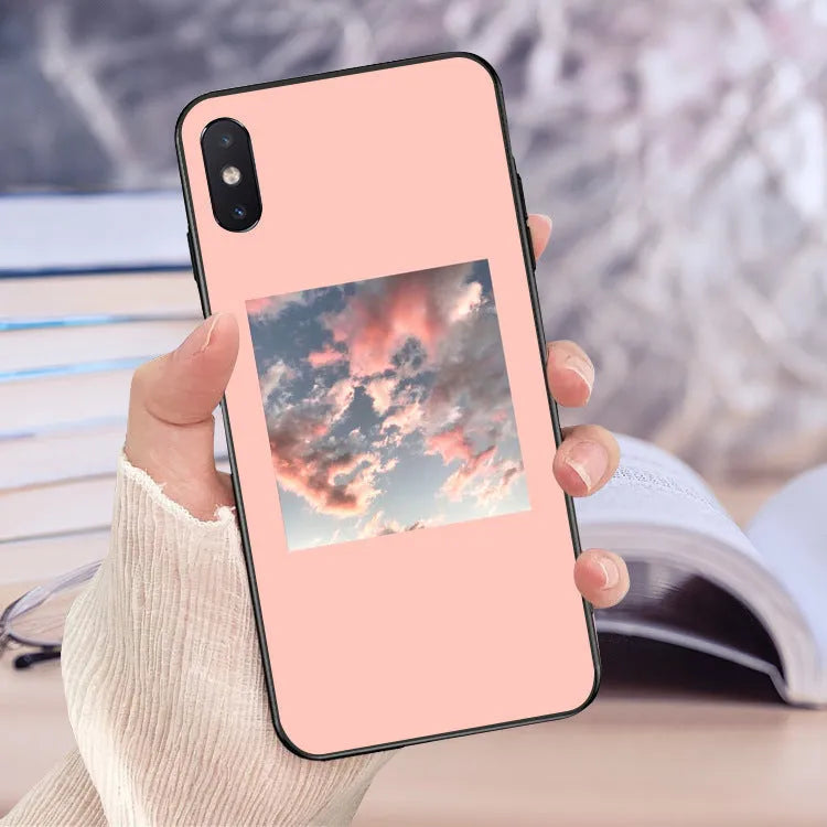 Pink painted iPhone case with textured roll brush design, lattice patterns, letters, and broken flower decorations on the back.