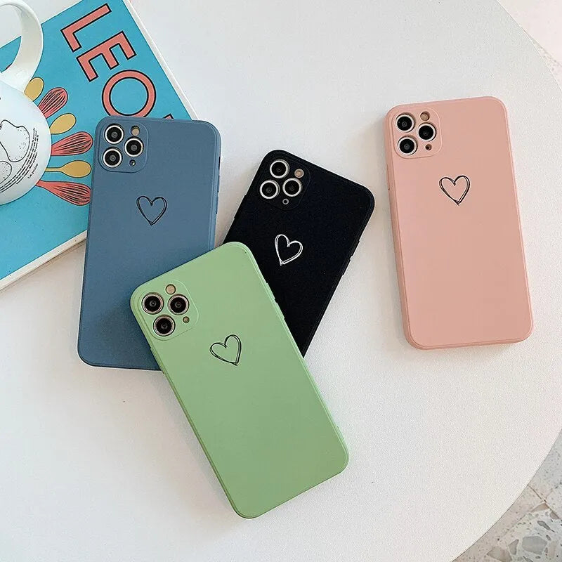 A solid colour silicone phone case for Apple iPhone on a table, showing its slim TPU back cover design.