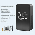 Small black wireless digital tyre inflator pump with screen, hose, and four air nozzles on a grey background.
