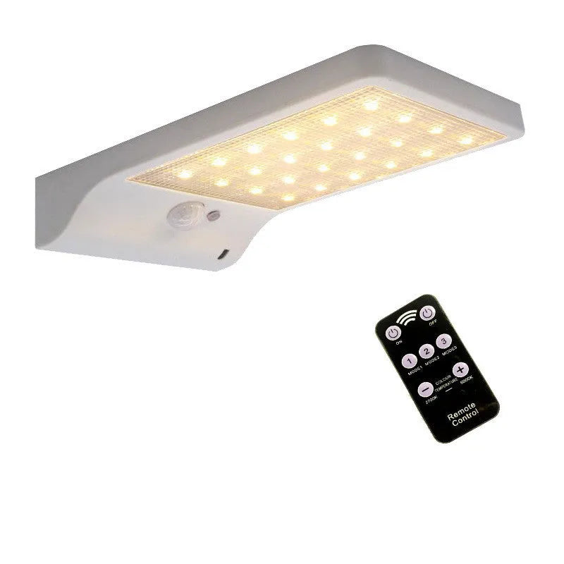 Black and white waterproof solar-powered LED garden light for outdoor use.
