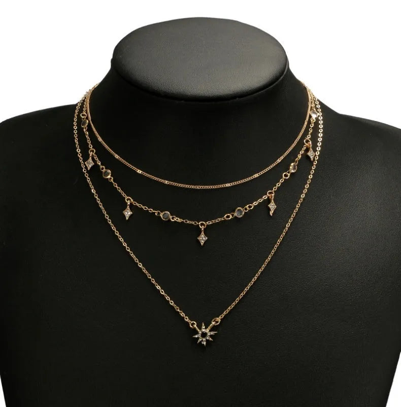 Handmade alloy multi-layer star pendant necklace in gold colour with layered chains and star pendants
