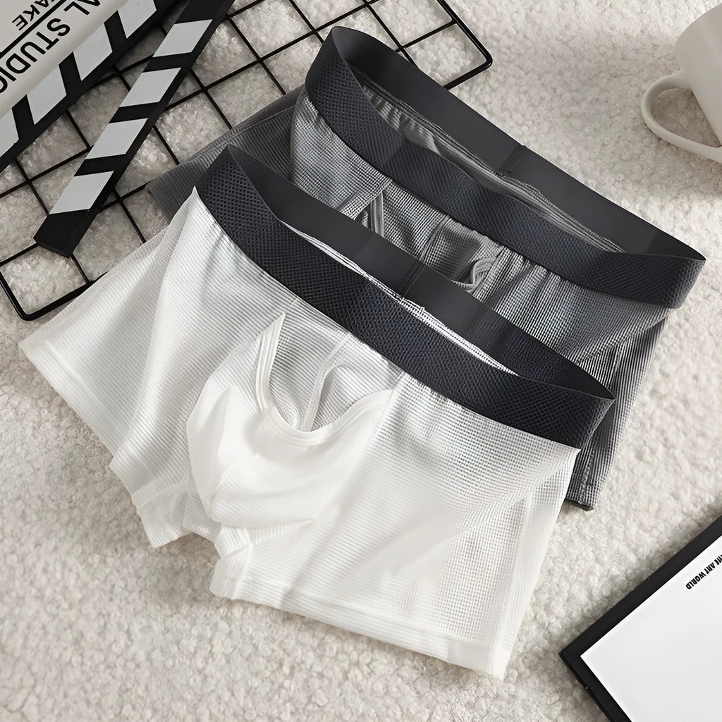 Men's ice silk boxer shorts with mesh fabric in black, white, and grey colour options